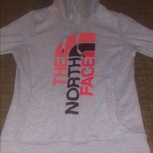Light North Face sweatshirt.